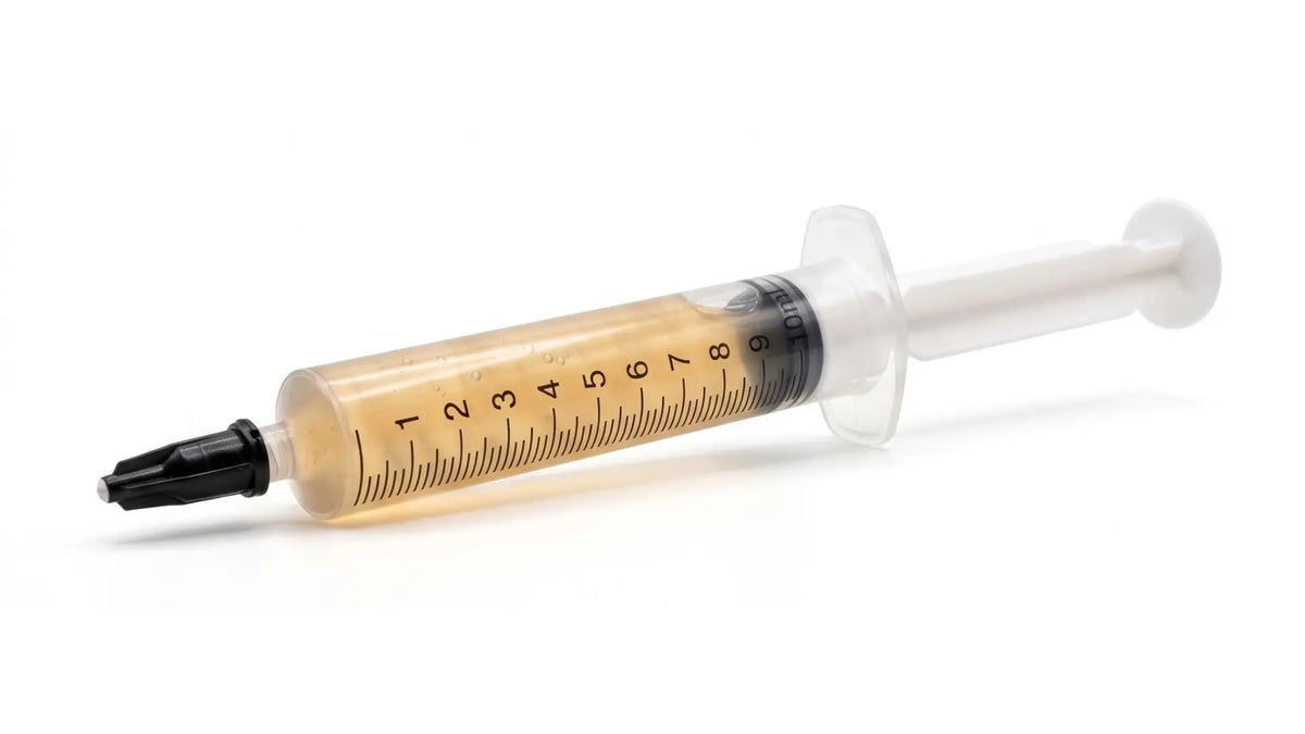 10ml liquid culture syringe filled with mycelium solution for mushroom growing.