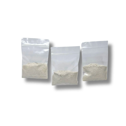 Three clear plastic ziploc bags filled with dry malt extract agar MEA powder.