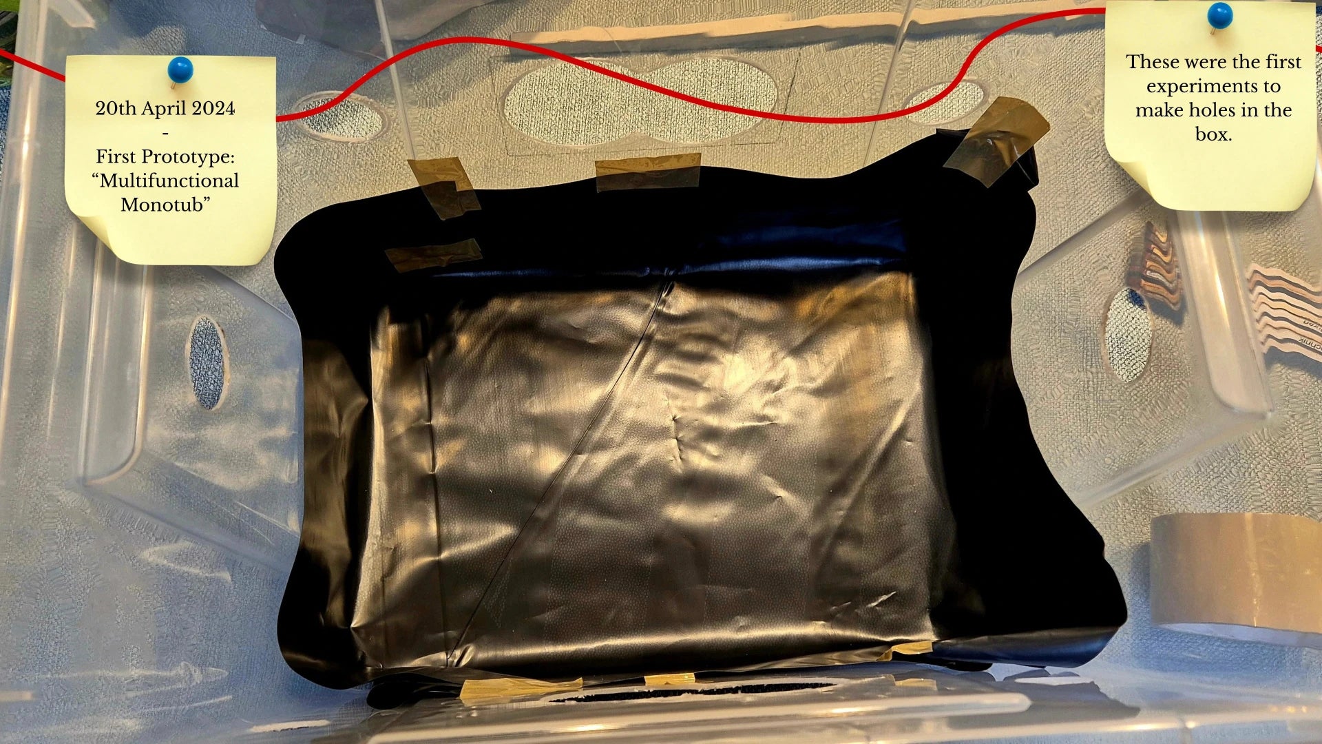 A plastic tub with a black liner and initial experimental ventilation holes taped at the edges. A sticky note dated April 20, 2024, identifies this as the first prototype for the "Multifunctional Monotub."